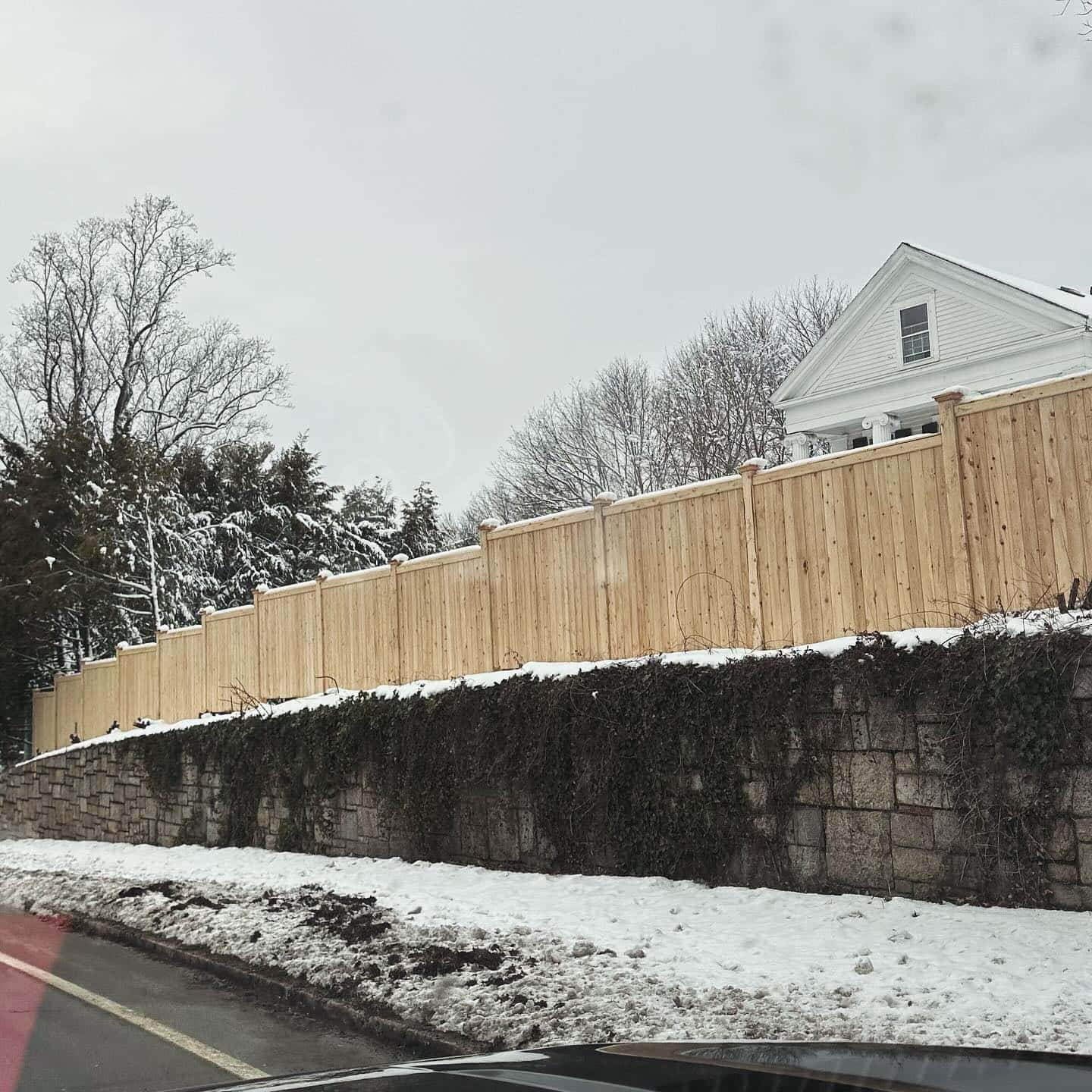 Wood fence installation in Wellesley, Massachusetts